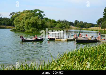 Boating on Holkam Lake in grounds of Holkham Hall, Holkham, Norfolk, England, United Kingdom Stock Photo