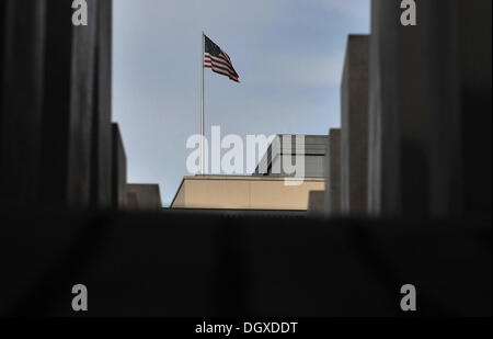 Berlin, Germany. 27th Oct, 2013. The American flag waves ontop of the US embassy in Berlin, Germany, 27 October 2013. Photo: PAUL ZINKEN/dpa/Alamy Live News Stock Photo