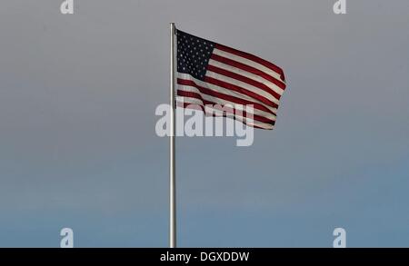 Berlin, Germany. 27th Oct, 2013. The American flag waves ontop of the US embassy in Berlin, Germany, 27 October 2013. Photo: PAUL ZINKEN/dpa/Alamy Live News Stock Photo