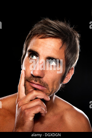 Young man thinking, Portrait Stock Photo