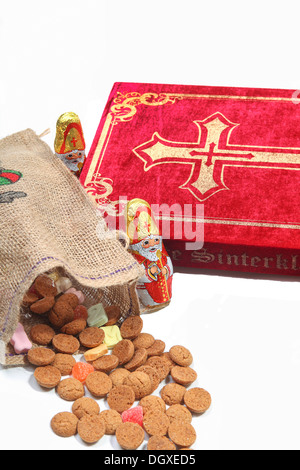 Book of Sinterklaas with candy in bag Stock Photo