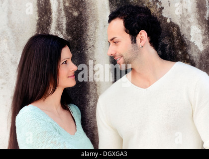 Young couple looking at each other, smiling, Austria Stock Photo