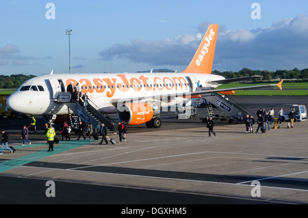 Passengers disembark from an Easyjet plane Stock Photo