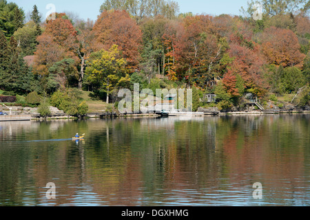 Canada, Ontario, Brockville. Kayaker on a calm fall morning along the Saint Lawrence Seaway. Stock Photo