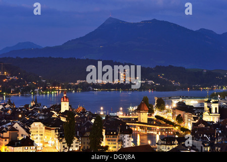 Old town of Lucerne with Chapel Bridge and water tower at dusk, Rigi at back, Lucerne, Switzerland, Europe Stock Photo