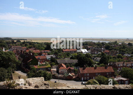 Looking down onto the village of Orford from the medieval castle with Orford Ness on the horizon, Suffolk Stock Photo