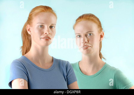 Young red-haired twin sisters, portrait Stock Photo