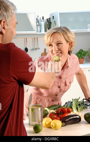 Couple, 35 - 45 years, in love, cooking in the kitchen Stock Photo