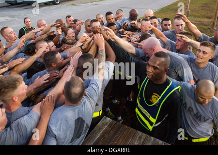 Male and female Drill Sergeant candidates at the US Army Drill Instructors School Fort Jackson during morning exercise September 27, 2013 in Columbia, SC. While 14 percent of the Army is women soldiers there is a shortage of female Drill Sergeants. Stock Photo