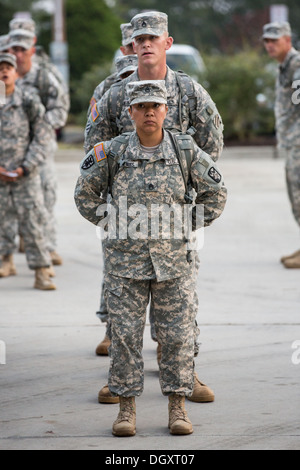 Male and female Drill Sergeant candidates at the US Army Drill Instructors School Fort Jackson during close order drill exercises September 26, 2013 in Columbia, SC. While 14 percent of the Army is women soldiers there is a shortage of female Drill Sergeants. Stock Photo