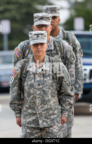 Male and female Drill Sergeant candidates at the US Army Drill Instructors School Fort Jackson during formation September 26, 2013 in Columbia, SC. While 14 percent of the Army is women soldiers there is a shortage of female Drill Sergeants. Stock Photo