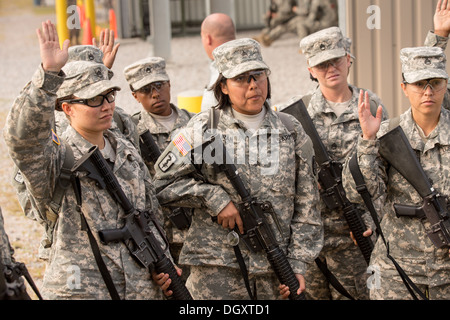 Women Drill Sergeant candidates at the US Army Drill Instructors School Fort Jackson listen during weapons training September 26, 2013 in Columbia, SC. While 14 percent of the Army is women soldiers there is a shortage of female Drill Sergeants. Stock Photo