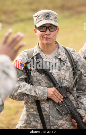 Women Drill Sergeant candidates at the US Army Drill Instructors School Fort Jackson listen during weapons training September 26, 2013 in Columbia, SC. While 14 percent of the Army is women soldiers there is a shortage of female Drill Sergeants. Stock Photo