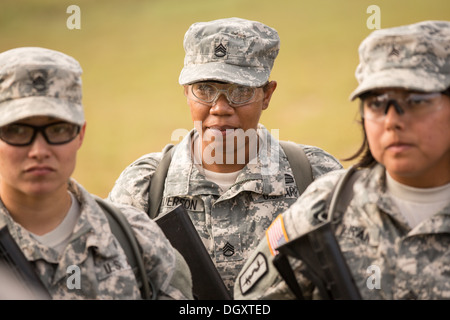 Women Drill Sergeant candidates at the US Army Drill Instructors School Fort Jackson listen during weapons training September 26, 2013 in Columbia, SC. While 14 percent of the Army is women soldiers there is a shortage of female Drill Sergeants. Stock Photo