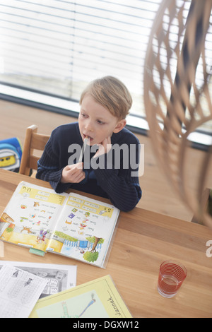 Schoolboy, 7 years, doing his homework, Germany Stock Photo