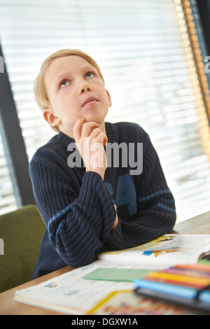 Schoolboy, 7 years, doing his homework, Germany Stock Photo