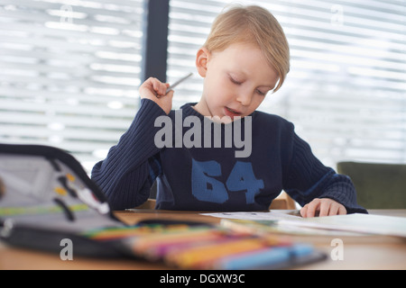 Schoolboy, 7 years, doing his homework, Germany Stock Photo