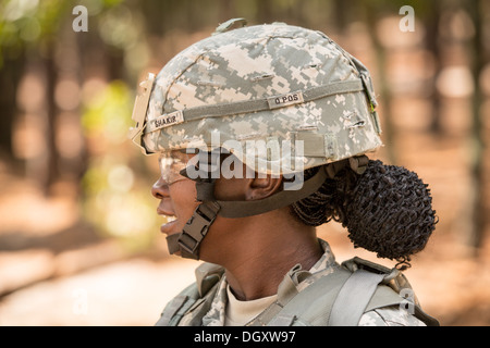 A woman Drill Sergeant observes her recruits during basic combat training at Fort Jackson September 27, 2013 in Columbia, SC. While 14 percent of the Army is women soldiers there is a shortage of female Drill Sergeants. Stock Photo