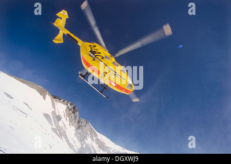 ADAC helicopter during a mountain rescue, Spitzingsee, Schliersee, Upper Bavaria, Bavaria, Germany Stock Photo