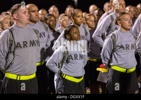 Male and female Drill Sergeant candidates at the US Army Drill Instructors School Fort Jackson line up before taking their physical training test early morning September 27, 2013 in Columbia, SC. While 14 percent of the Army is women soldiers there is a shortage of female Drill Sergeants. Stock Photo