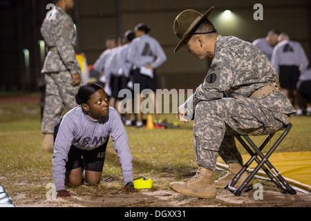 A female Drill Sergeant candidates at the US Army Drill Instructors School Fort Jackson take their entry physical training test early morning September 27, 2013 in Columbia, SC. While 14 percent of the Army is women soldiers there is a shortage of female Drill Sergeants. Stock Photo