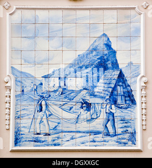 Azulejo, mural made of painted ceramic tiles, tourist being carried in a hammock, on the local theatre in Funchal, Madeira Stock Photo