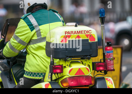 UK Paramedic close up on a motorbike ready to save lives. View from the rear behind. Close up (macro) Stock Photo