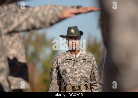 A female Drill Sergeant instructor observes candidates at the US Army Drill Instructors School Fort Jackson during close order drill exercises September 27, 2013 in Columbia, SC. While 14 percent of the Army is women soldiers there is a shortage of female Drill Sergeants. Stock Photo