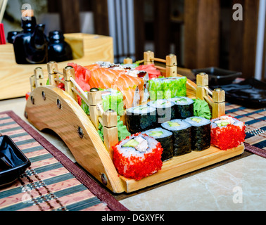 Assorted japanese sushi on a wooden plate. Stock Photo