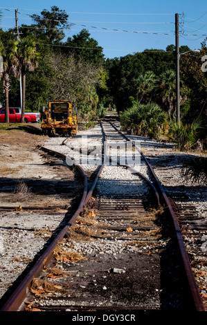 Old rusting abandoned railroad tracks line spur running through Mount Dora. Stock Photo