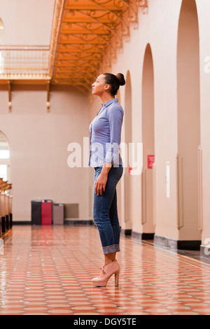 Young African-American woman full-length, profile view Stock Photo