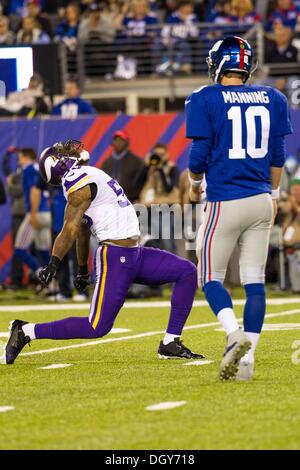 East Rutherford, New Jersey, USA. 27th Oct, 2013. October 21, 2013: Minnesota Vikings outside linebacker Marvin Mitchell (55) reacts to his tackle as New York Giants quarterback Eli Manning (10) is near by during the NFL game between the Minnesota Vikings and the New York Giants at MetLife Stadium in East Rutherford, New Jersey. (Christopher Szagola/Cal Sport Media) © csm/Alamy Live News Stock Photo