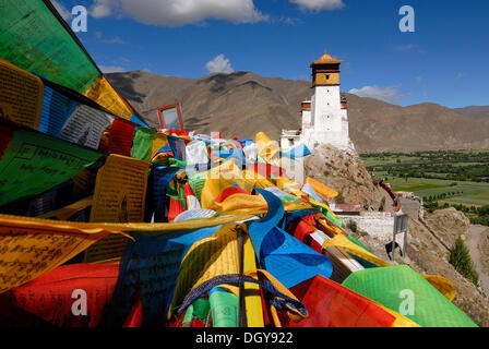 Prayer flags are flying on Yumbulagang Palace above the Yarlung Valley, the first and oldest fortress of Tibet, Central Tibet Stock Photo