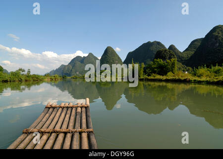 Bamboo raft on the Yulong river in the karst landscape near Yangshuo, Guilin, Guangxi, China, Asia Stock Photo