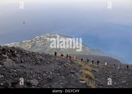 Tourist group hiking to the crater of Mt Stromboli, volcanic island of Stromboli, Aeolian Islands or Lipari Islands, Sicily Stock Photo