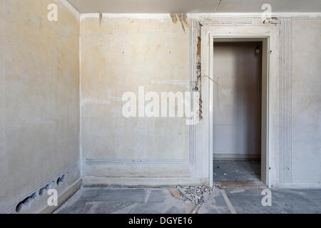 Preparatory work on a wall for installing new cable canals and sockets, electrical wiring in an old building, Stuttgart Stock Photo