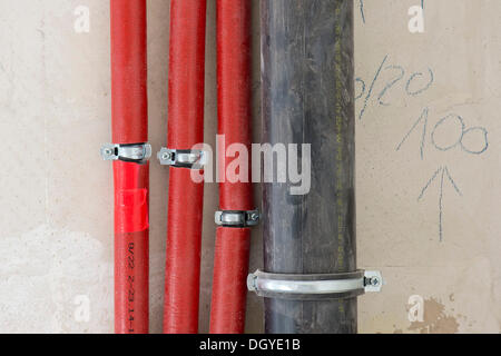 Newly installed heating pipes and water pipes in an old building, Stuttgart, Baden-Wuerttemberg Stock Photo