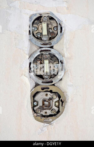 Outdated electrical wiring, switches and socket, Stuttgart, Baden-Wuerttemberg Stock Photo