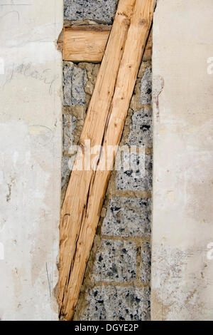 Preparatory work on a wall for installing new cable canals under plaster, exposed timber frame and masonry in an old building Stock Photo
