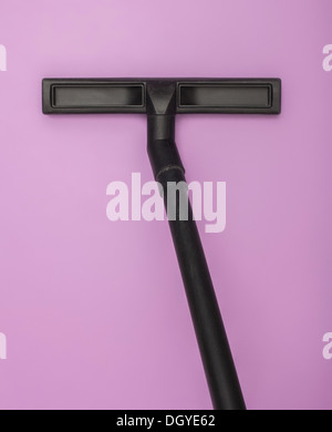 Angular vacuum cleaner hose against a lilac background Stock Photo