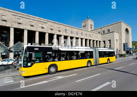 Yellow bus in front of the central railway station, Stuttgart, Baden-Wuerttemberg Stock Photo