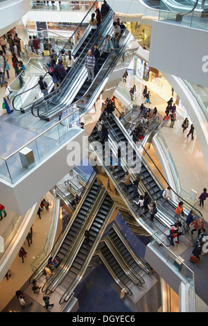 People on escalators in Festival Walk shopping mall, Kowloon Tong, Kowloon, Hong Kong, China Stock Photo