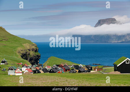 Village with typical colourful houses, Kalsoy island at back, Gjogv, Eysturoy, Faroe Islands, Denmark