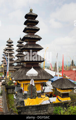 Temple festival, Besakih Temple and pilgrimage shrine at the foot of Mount Agung decorated with flags and umbrellas, Besakih Stock Photo