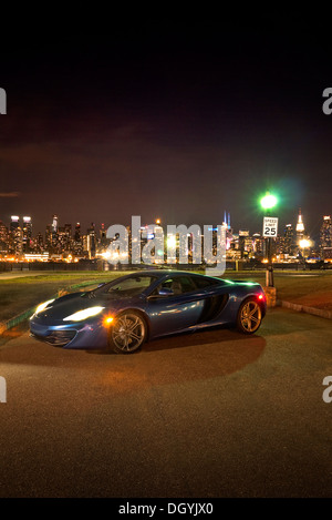 McLaren MP4 12C on the New Jersey shore overlooking New York at night. Stock Photo