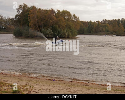 MERE BROW, TARLETON, LANCASHIRE, UK. 27th October 2013. Jet Skiers brave the 40mph winds as St Jude Storm approaches. © Sue Burton/Alamy Live News Stock Photo