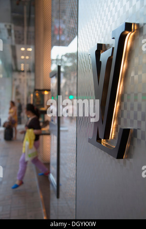 Pedestrians are seen in front of a French luxury fashion brand Louis Vuitton  (LV) store in Hong Kong. (Photo by Budrul Chukrut / SOPA Images/Sipa USA  Stock Photo - Alamy