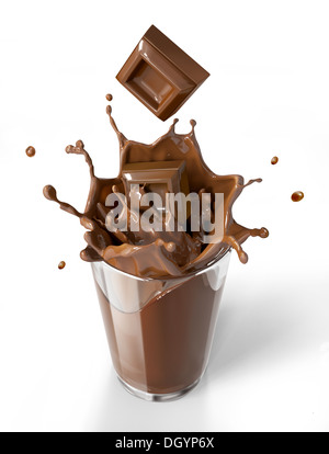 Chocolate cubes splashing into a chocolate milkshake glass. Bird eye view, on white background. Clipping path included. Stock Photo