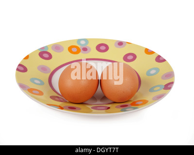 two boiled eggs on kitchen plate Stock Photo