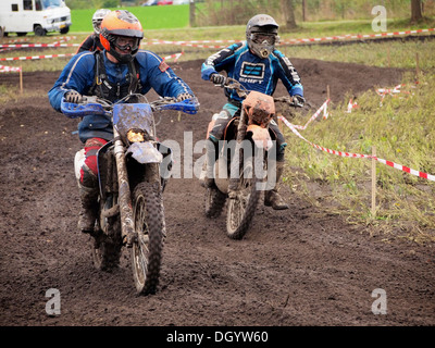 Recreational enduro motorcycle riders on a dirt track part of the course in Ruurlo, Gelderland, the Netherlands Stock Photo